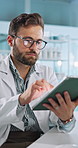 Tablet, scientist and man in laboratory for medical test, experiment results and innovation. Science research, scroll and digital technology for medicine development, pharma and healthcare study