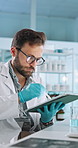 Tablet, scientist and man with test for medical experiment, results and chemistry innovation. Science research, pen and digital technology for medicine development, pharma and healthcare study in lab