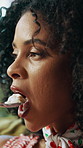 Woman, happy and eating ice cream in home with craving satisfaction, comfort food and enjoying snack. Hungry, african person and frozen dessert on sofa for unhealthy pleasure, reward or weekend break