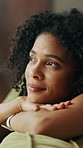 Home, thinking and woman on sofa, relax and smile with contemplation in living room. Apartment, girl and happy person on couch, weekend break and daydreaming with decision, morning and calm in lounge