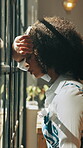 African woman, window and stress with anxiety, mistake or regret with reflection for decision in home. Person, sad and thinking with perspective, loss or grief with mental health in morning at house