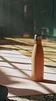Water bottle, drink and hydration with exercise mat on floor, health and nutrition with cold beverage in sunlight. Fitness, wellness and h2o for thirst, detox and electrolytes in flask at home