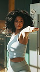 Warrior pose, yoga and fitness with woman in home, balance and calm with stretching in kitchen. Health, wellness and African yogi person for workout, exercise and holistic self care in apartment