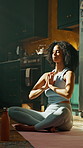 Prayer, meditation and woman in lotus pose in home for relax, zen or mental health in living room. Calm, inner peace and female person with yoga for mindfulness, energy or spiritual growth in house.