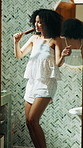 Singing, brush and woman in house dancing to music, playlist or radio for getting ready. Happy, energy and female person with hair tool for karaoke performance for fun with grooming in bathroom.