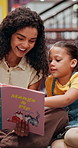 Happy, teacher and child with book in library for knowledge, fantasy story and language development. Woman, student and excited with novel for learning support, storytelling and reading information