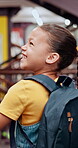 Back, kid and walking in library for education, learning and happy for leaving kindergarten. Young girl, backpack and smile in school for recess, child development and excited in academy for growth