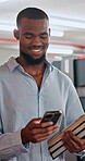 Smile, black man and student with phone in library for communication, research and education feedback. Person, walking and mobile for social media, scholarship application and learning notification