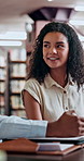 Student, woman and discussion in university library for research, education and knowledge in team project. Studying, friends and learning on campus with books, support and help with scholarship