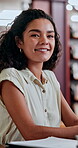 Woman, student and face for education in library for knowledge, research and information on project. Portrait, person and studying for learning, university assessment and homework for academic growth