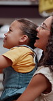 Mother, child and selection with book at library for story, knowledge or literature novel at store. Mom, academic or playful parent with kid by bookshelf for choice, pick or decision at bookshop