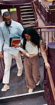 University, students and library stairs with books for information, learning or knowledge for academic citation. Study session, friends and education with research, scholarship and walking people