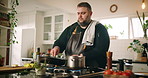 Cooking, home and man in kitchen, food and diet with healthy ingredients, recipe and culinary skills. Person, apartment or professional with nutrition, chef or lunch with gourmet, cuisine or wellness