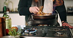 Hands, chef and fire with pan in kitchen for cooking with ingredients, meal prep and gourmet cuisine. Person, stove and flame with food, nutrition and process with dish for fine dining at apartment