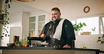Man, chef and fire with pan in kitchen for cooking with ingredients, meal prep or smile for gourmet cuisine in home. Person, stove and flame with food, nutrition and happy with dish at apartment