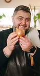 Talking, recording and face of chef in home explaining onion for meal tutorial, advice or recipe. Cooking, vegetable and portrait of man culinary artist with food tips for live streaming in house.