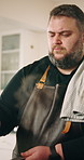 Cooking, chef and man in kitchen with food for culinary skills, meal prep and lunch or dinner in home. Private, hospitality and person with ingredients for nutrition, gourmet recipe and cuisine
