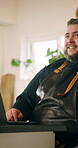 Smile, man and chef with phone call at house for communication, menu planning and catering service. Male person, laptop and mobile for discussion, recipe research and meal preparation for event order