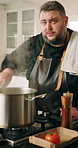 Face, influencer and man in kitchen, cooking and explain with recipe, live streaming and filming. Person, content creator and chef with pot, home and culinary skills with social media and tutorial