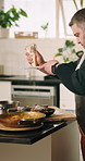 Chef, cheese and man in kitchen for cooking dinner, cuisine and meal preparation in home. Culinary professional, steak and person with pasta, recipe and ingredients for luxury protein and nutrition