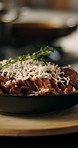 Cooking, plate and presentation of food in restaurant for culinary, meal prep and dinner. Kitchen, catering service and chef with closeup of ingredients for nutrition, gourmet dish and cuisine recipe