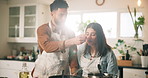 Couple, cooking and taste food in kitchen with meal preparation, helping and nutrition lunch. Embrace, man and feeding women for healthy ingredients, test gourmet cuisine and bonding together at home