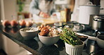 Food, ingredients and recipe with people in kitchen of home for preparation of meal or supper. Cooking, cuisine and vegetables with couple at apartment counter for diet, healthy eating or nutrition