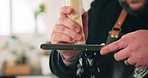 Hands, grate and man in kitchen, cheese and hospitality with ingredients, cooking process and fine dining. Closeup, person and chef with culinary skills, home and healthy meal with catering service