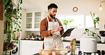 Cooking, recipe and tablet with man in kitchen of home for preparation of meal or supper. Food, ingredients and instructions with chef at counter in apartment for diet, healthy eating or nutrition