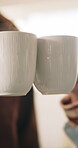 Morning, coffee and hands toast in home kitchen with conversation, cup and mug with drink. Couple, communication and love of people with cheers, house and marriage talking for breakfast plan with tea