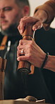 Person, hands and kitchen with food or seasoning for flavor, taste or adding ingredients at home. Closeup, chef or cook with spice dispenser or meal enhancement for recipe, hospitality or catering