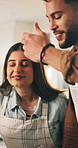 Couple, cooking and aroma with smell in kitchen, conversation and laugh for nutrition advice or dinner. Man, woman and teaching with ingredients, support and help with talking for meal prep in home
