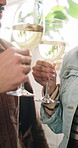 Wine, couple and hands toast in kitchen for date, dinner or lunch in home together. Smile, man and woman drinking alcohol beverage for cheers, glass or bonding for afternoon meal or anniversary