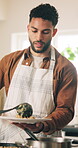 Man, stove and plate food in home for dinner meal, lunch preparation and cooking. Chef, person and dish homemade cuisine in kitchen with healthy ingredients, nutrition and hungry for gourmet recipe