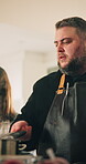 Cooking class, chef and woman with learning in kitchen for meal preparation, recipe instructions or gourmet food. People, talking and cuisine tutorial with technique, culinary skills or teaching menu