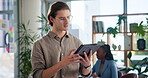Man, glasses and tablet in office for business, creative research and scroll on news website. Journalist, approve and tech in agency for networking, article investigation and positive review on forum