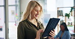 Woman, smile or tablet in office for business, creative research or scroll on news website. Journalist, happy or technology in agency for networking, article investigation or positive review on forum