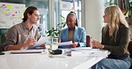 Creative, meeting and business people with documents for planning, project feedback and research. Startup, office and men and women with paperwork for marketing, advertising and brand strategy