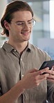 Man, phone and texting at office with networking, click and check notification for deal at tech startup. Person, smartphone and scroll on mobile app with smile, contact and social media at company