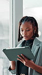 Business, online and black woman with tablet for research, networking and compliance officer with insight. Technology, reading and worker on internet for policy review, planning or report in office