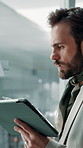 Glass wall, tablet and thinking with business man in office for brainstorming or strategy. Ideas, problem solving and writing with professional employee at work for creative development or design