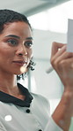 Glass wall, planning and writing with business woman in office for brainstorming or strategy. Ideas, mind map and sticky notes with professional employee at work for creative development or design