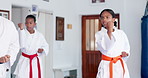 Girls, karate or class with fighting technique for self defense training, taekwondo or martial arts. Teenager, learning or practice session with kicking or punching for sport or lesson in aikido dojo