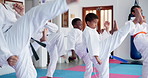 Children, karate and class with fighting kata for self defense training, taekwondo or martial arts. Kids, learning and practice session with kicking and punching for sport or lesson in aikido dojo