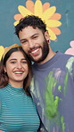 Couple, face and hug by flower wall for painting, creative bonding and love with happiness for DIY art project. Man, woman and portrait embrace with painter team, support and aesthetic floral design