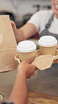 Hands, barista and customer in coffee shop, takeaway and purchase of hot beverage, cup or morning. Hospitality, consumer and server with package in small business, people or sale of breakfast in cafe