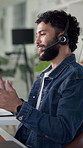 Headset, man and customer service agent in office for communication, contact us or help desk. Technology, call center and male consultant talking with online discussion for crm support in workplace.