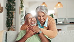 Face, hug and home with senior couple, love and bonding together in living room. Portrait, apartment or old man with mature woman, embrace or care with trust, relationship or marriage with retirement