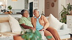 Senior, couple and laughing on sofa in retirement for funny conversation, comic story and bonding together. Happy, elderly people and relax in home with discussion, relationship and trust with love