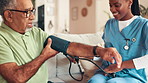 Nurse, senior man and blood pressure test in home for cardiovascular health, wellness and measure heart rate. Caregiver, cuff and medical exam for hypertension, checkup or monitor pulse in retirement